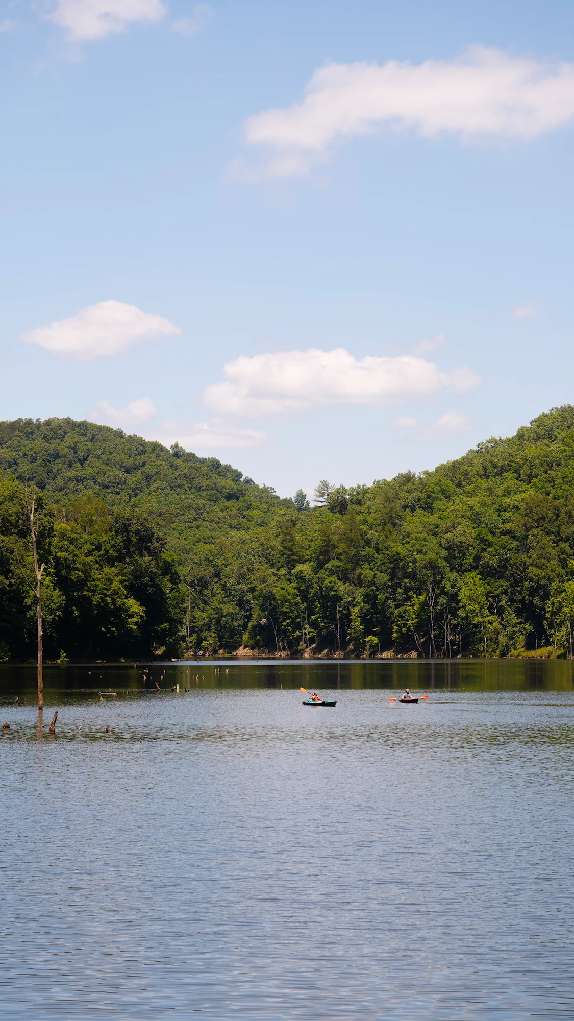 View of kayakers on the scenic 50 acre lake at Mountwood Park in Waverly, WV.